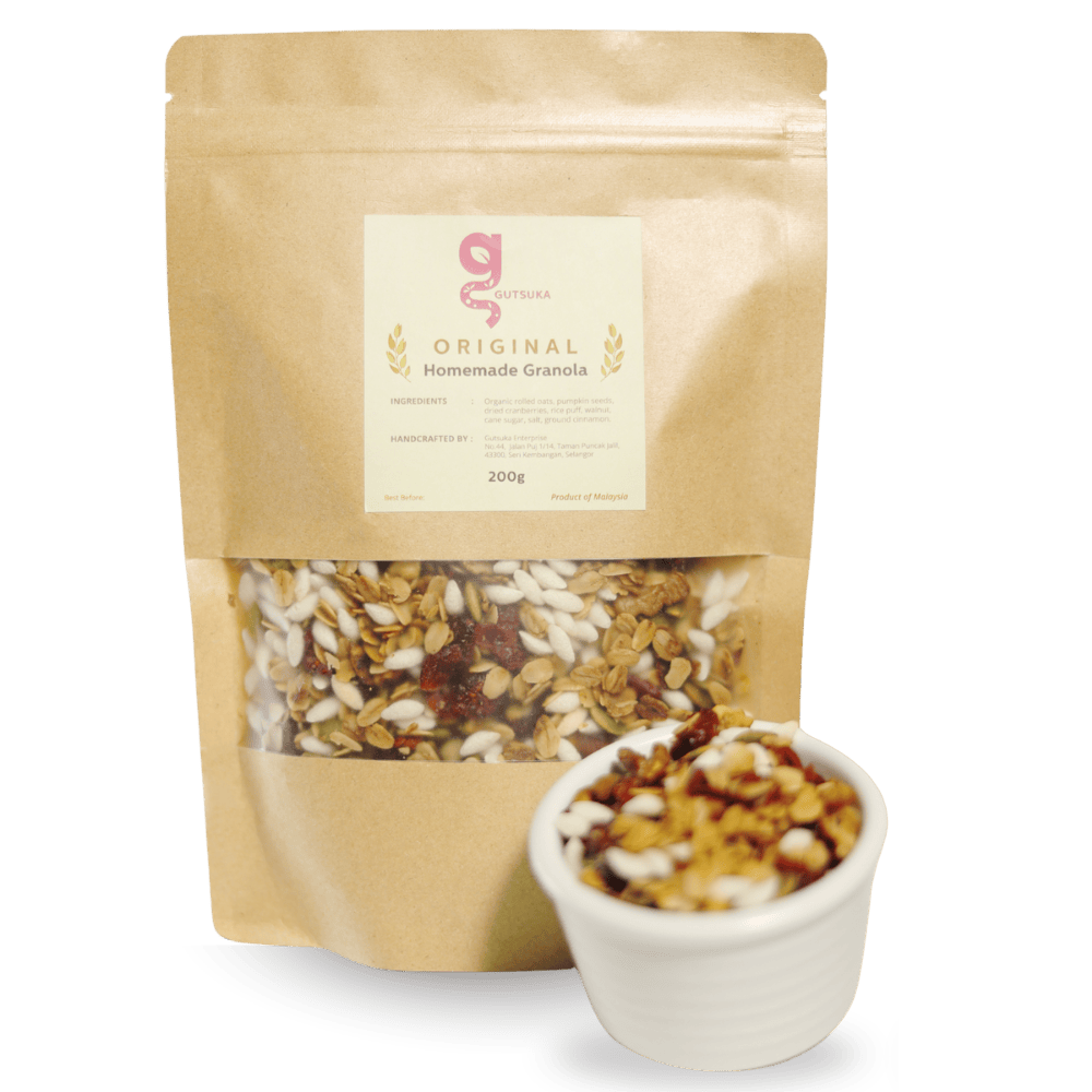 Dairy-Free Coconut Yogurt in Malaysia Gutsuka Original Homemade Granola 200g bag with a small bowl of mixed nuts, seeds, and dried cranberries.